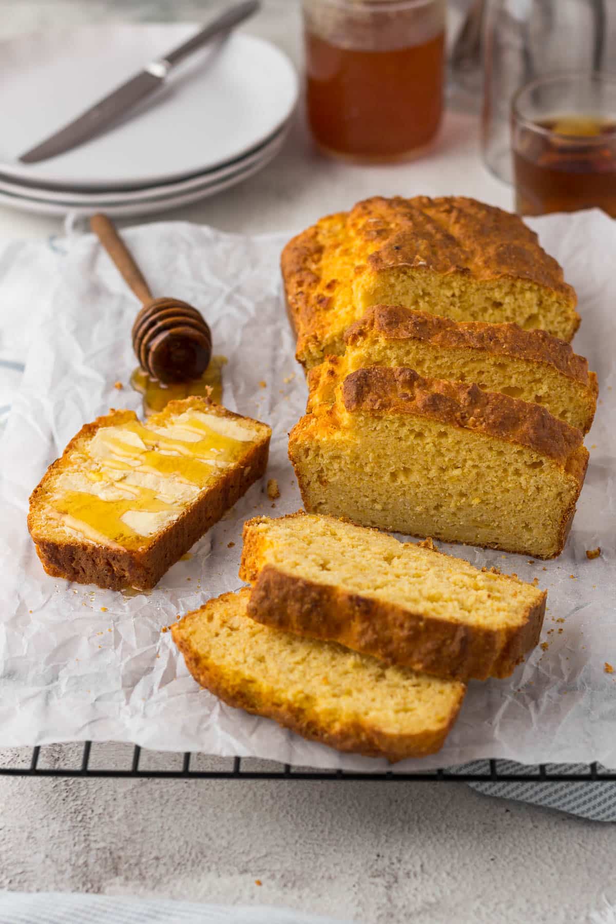 Sliced mealie bread with butter and honey.