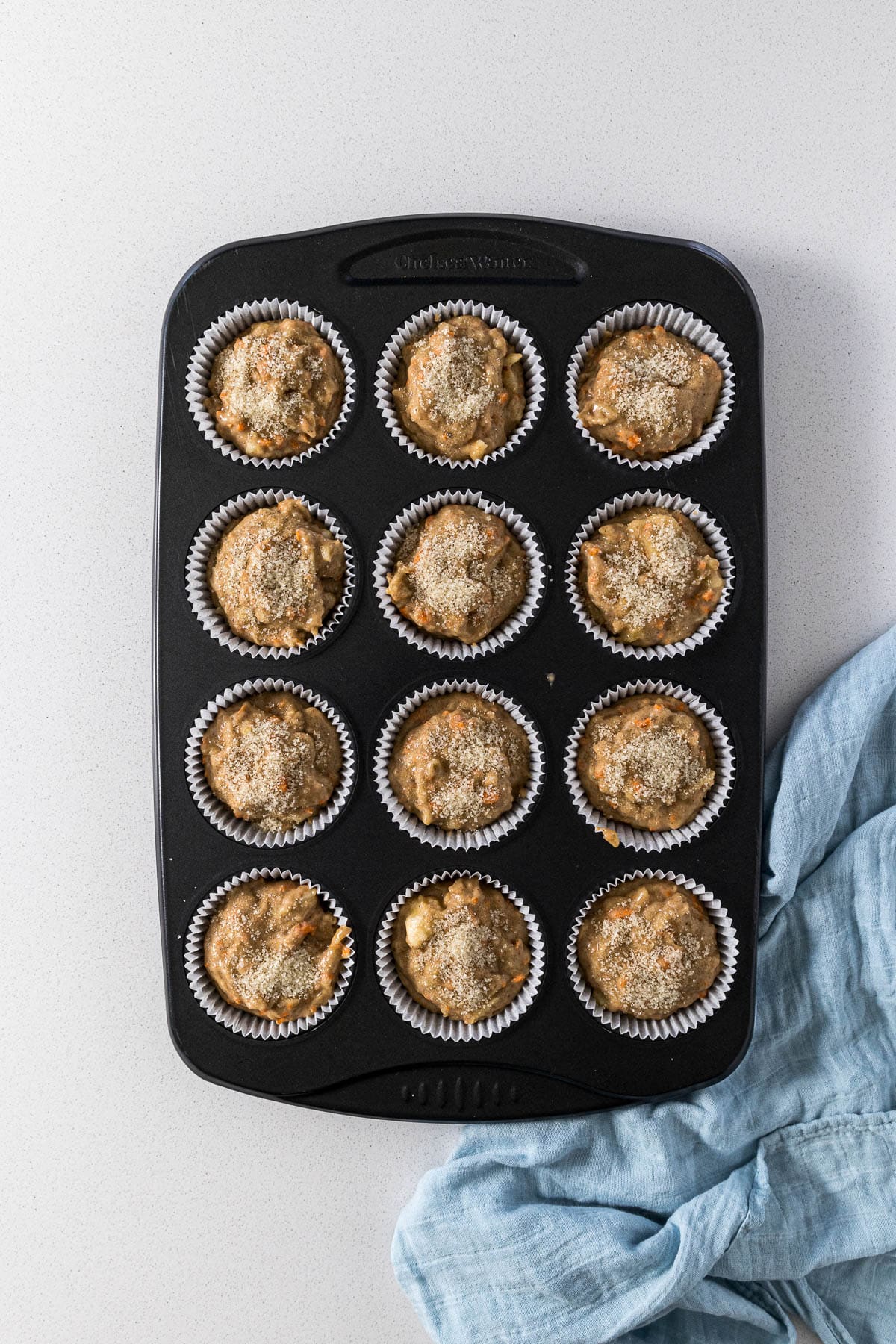 Step 6 - Filled cupcake liners topped with sugar.