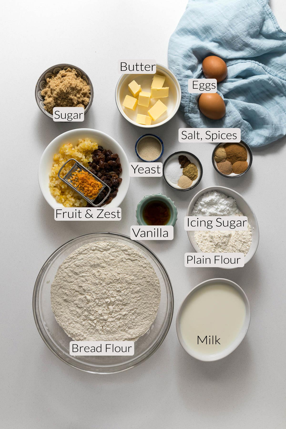 Hot cross bun ingredients in bowls.