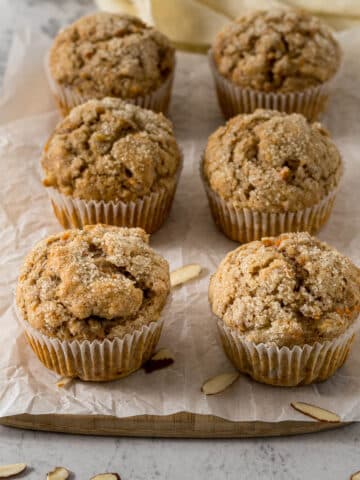 Banana carrot muffins on a serving board.