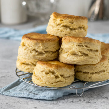 Pile of scones on a cooling rack.