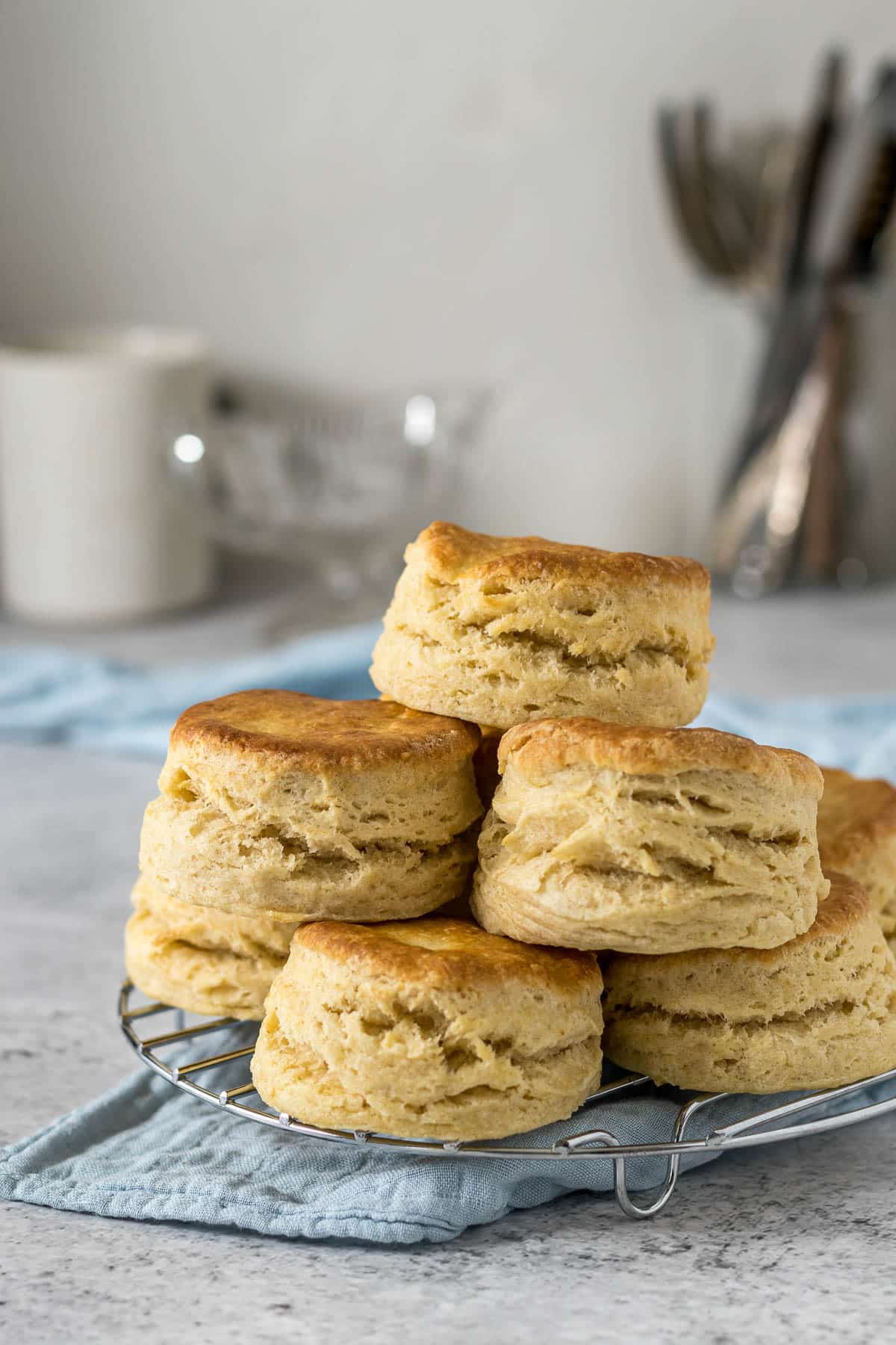 Pile of scones on a cooling rack.