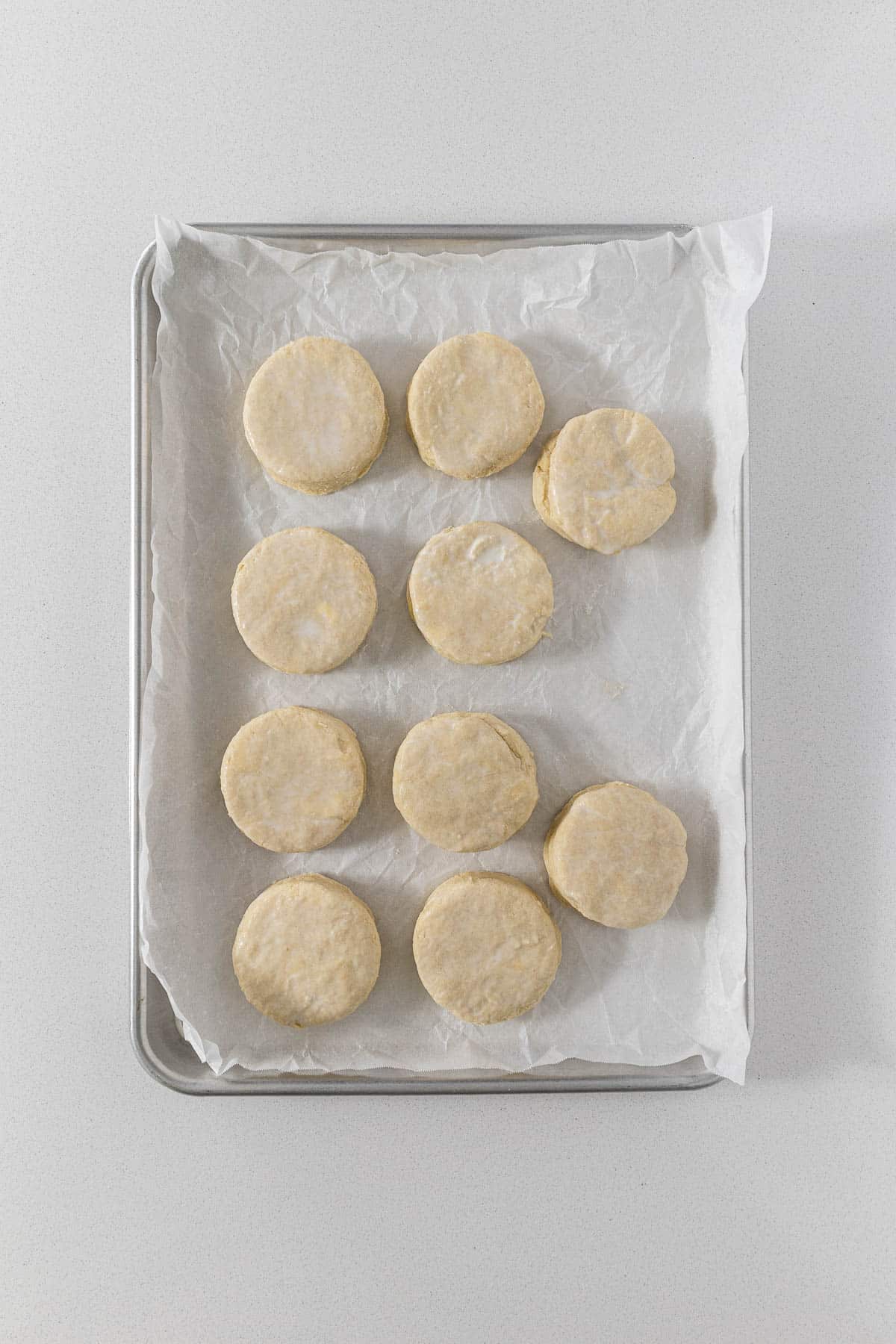 Step 9 - scones on baking tray brushed with milk.