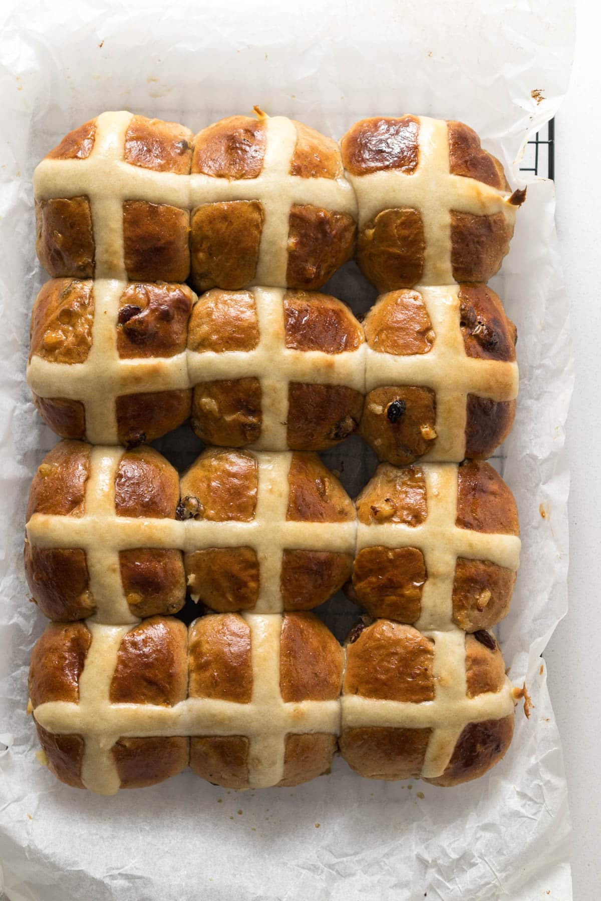 Step 15 - baked hot cross buns on baking paper.