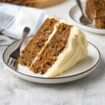 Slice of carrot cake on a plate.