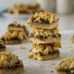 Stack of date and oat slices on top of each other.