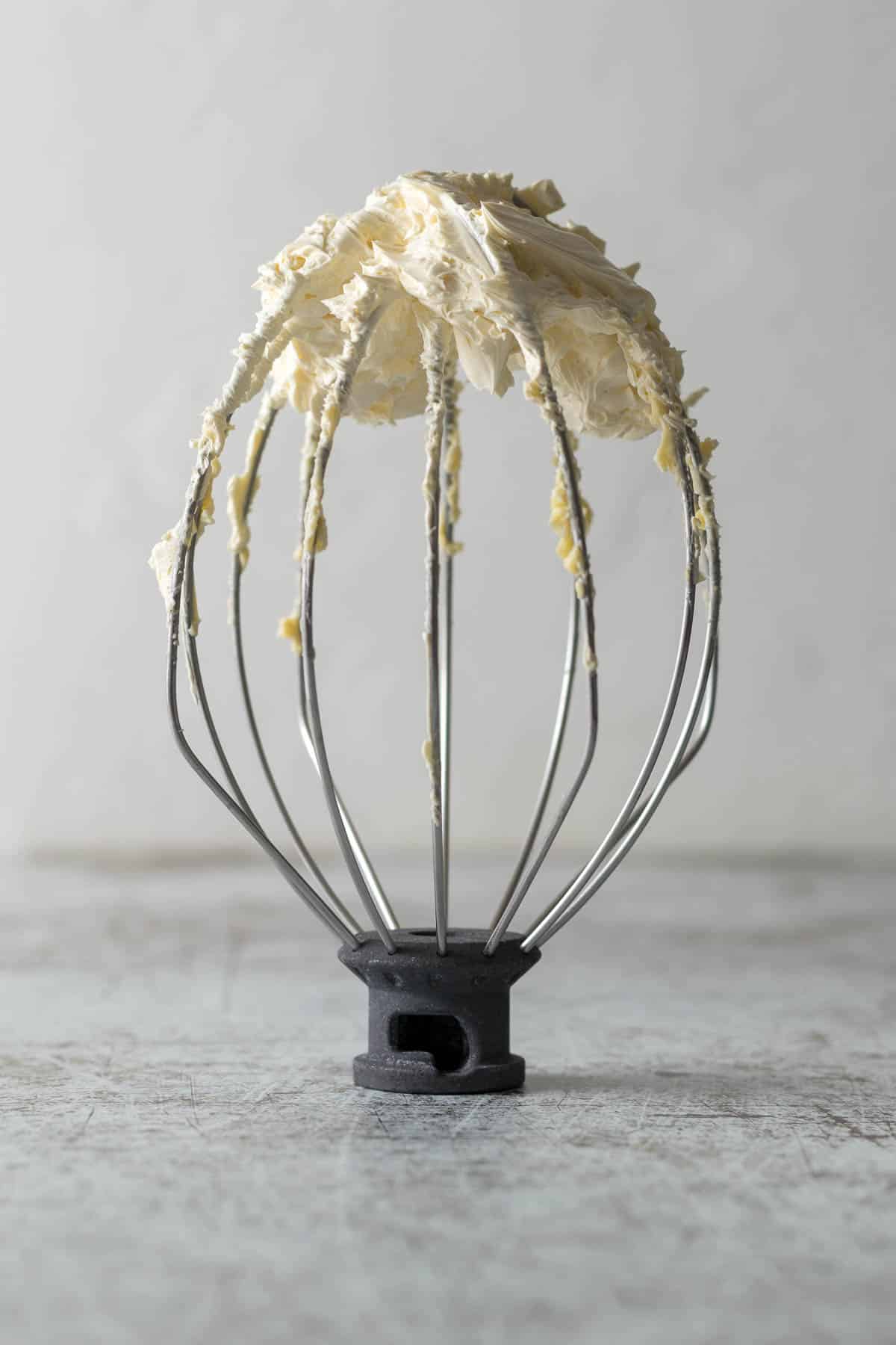 Whipped butter on a whisk attachment.