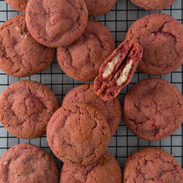 Strawberry cheesecake cookies on a cooling rack.