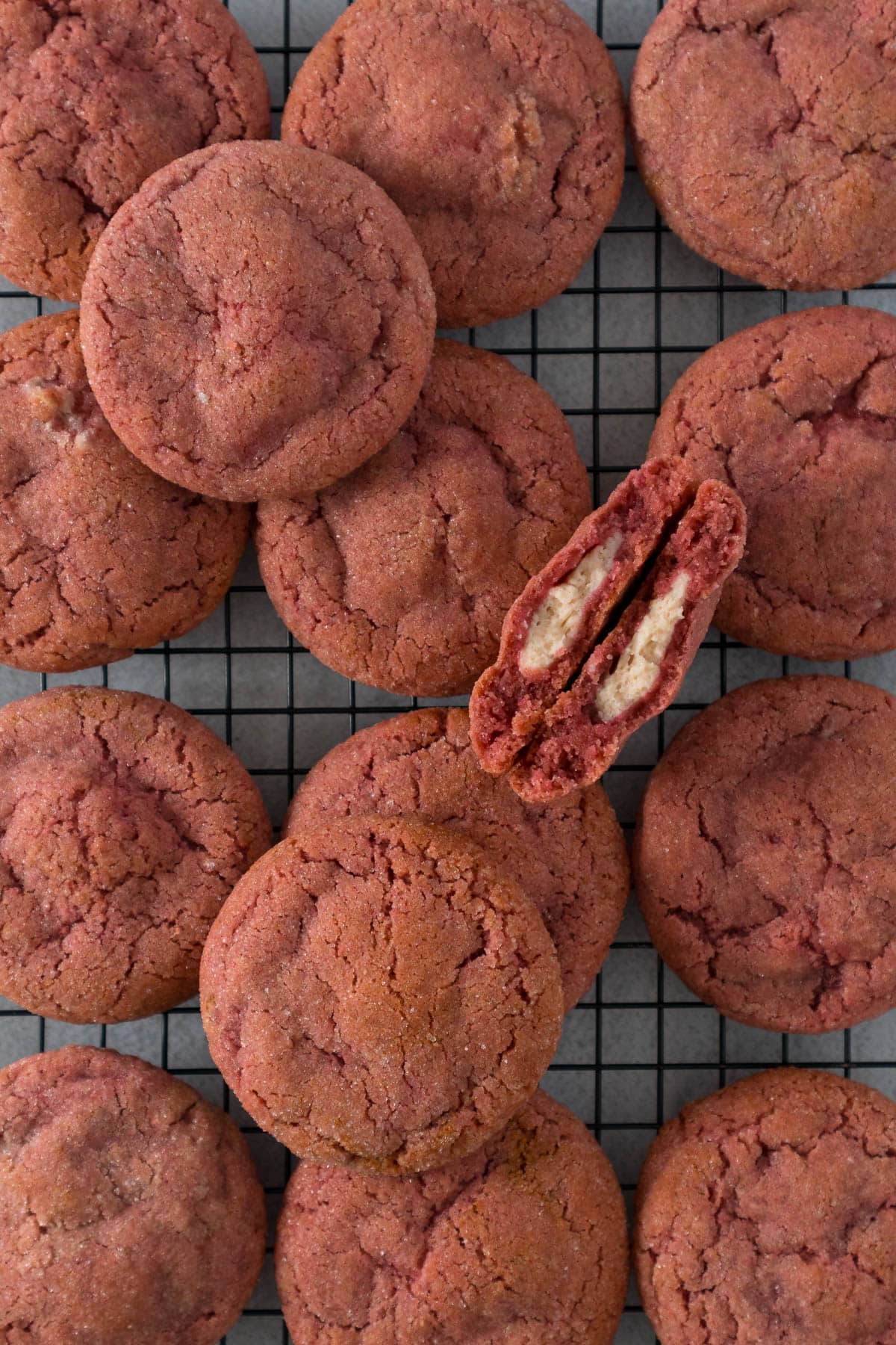 Strawberry cheesecake cookies on a cooling rack.