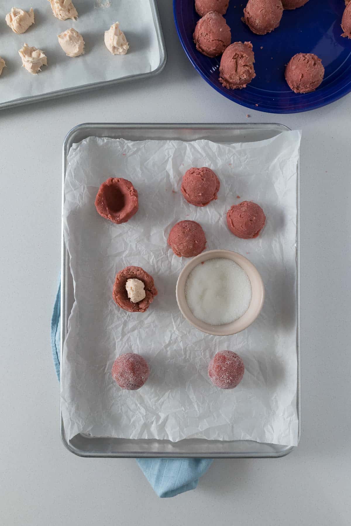 Step 8 through 10 showing the cookie dough with cream cheese filling, and then rolled and coated in sugar.