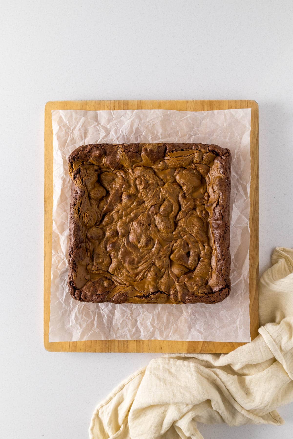 Step 9 - Baked Biscoff brownie on cutting board.