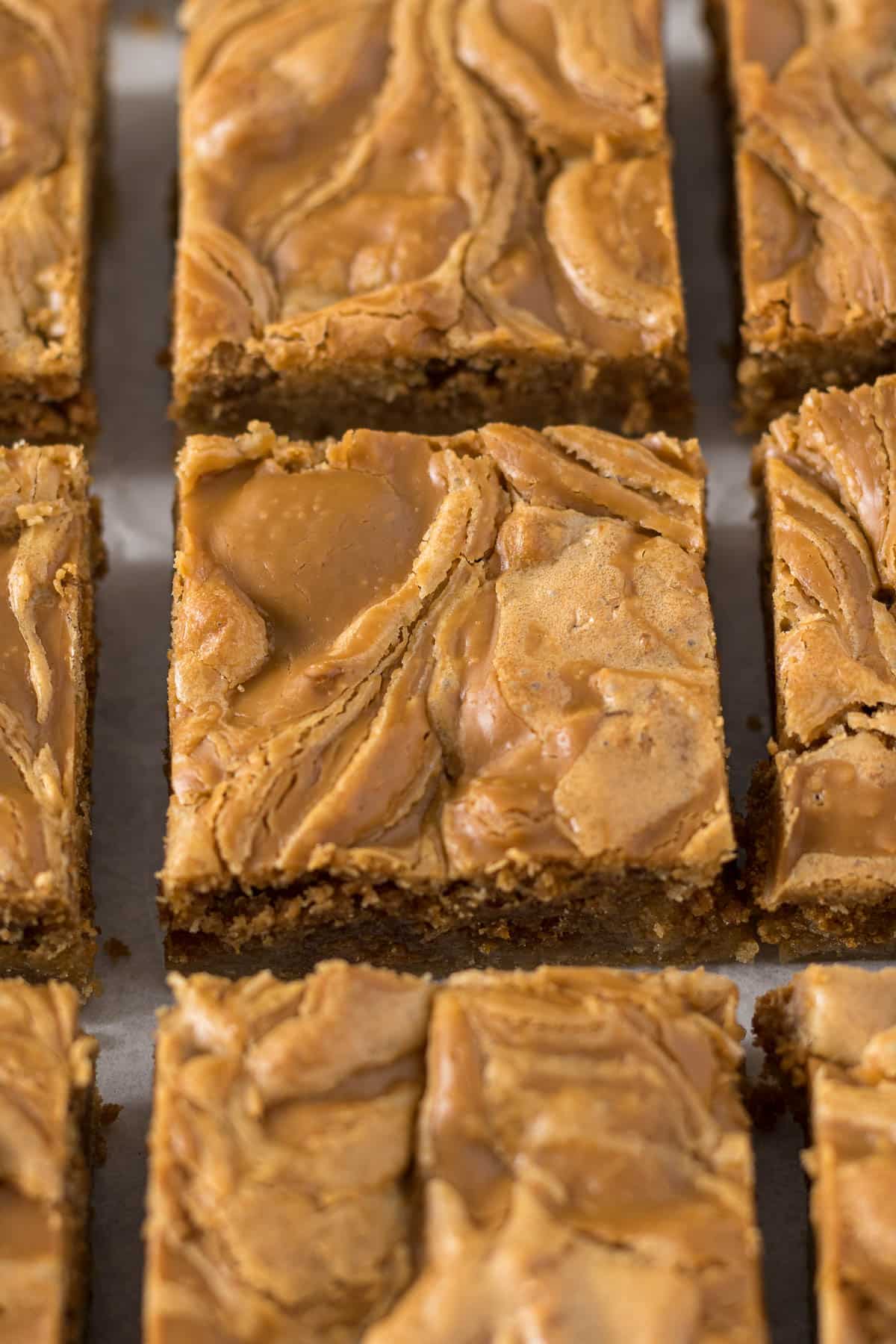 Sliced Biscoff blondie showing the swirl of Biscoff spread through the blondie.