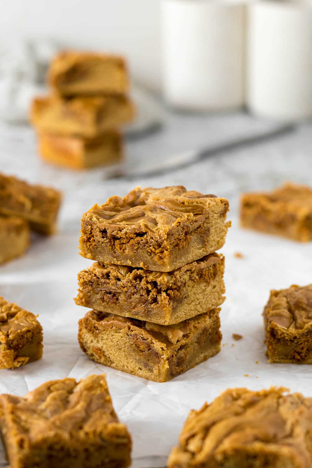 Three Biscoff blondies stacked on each other.