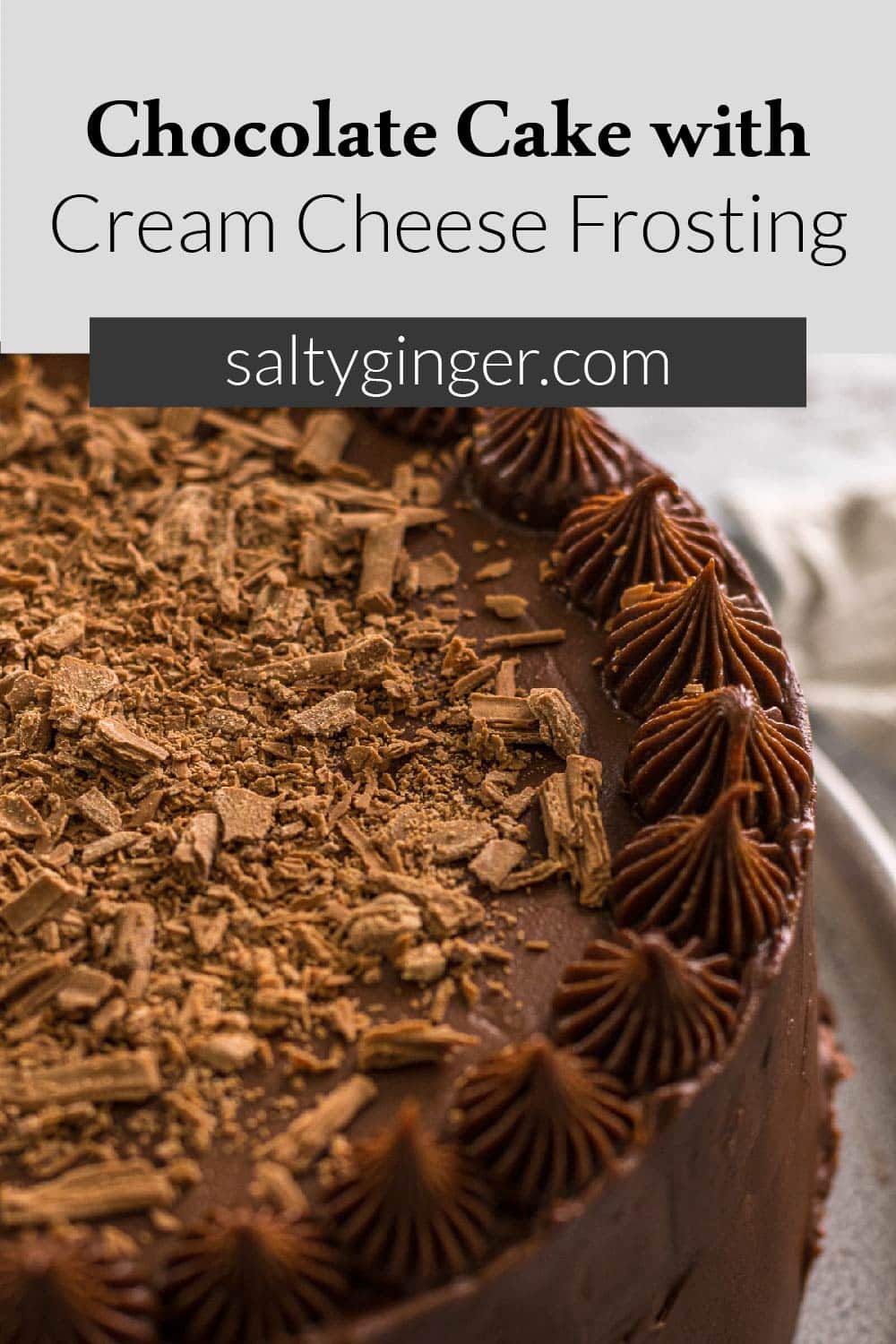 Pin - Chocolate cake with cream cheese frosting topped with flakey chocolate.
