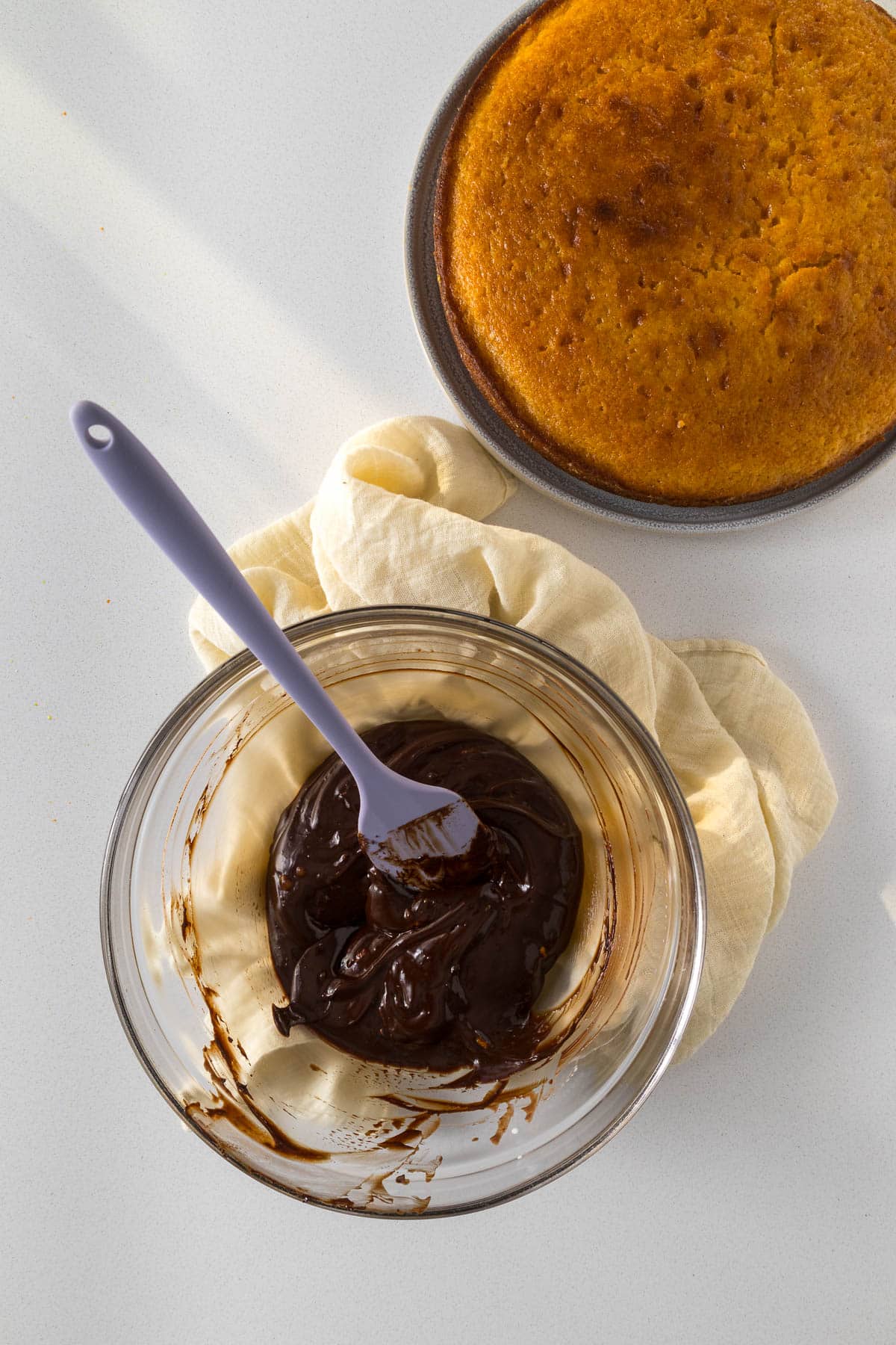 Step 10 - shiney, smooth chocolate ganache ready to be spread on top of the orange cake.