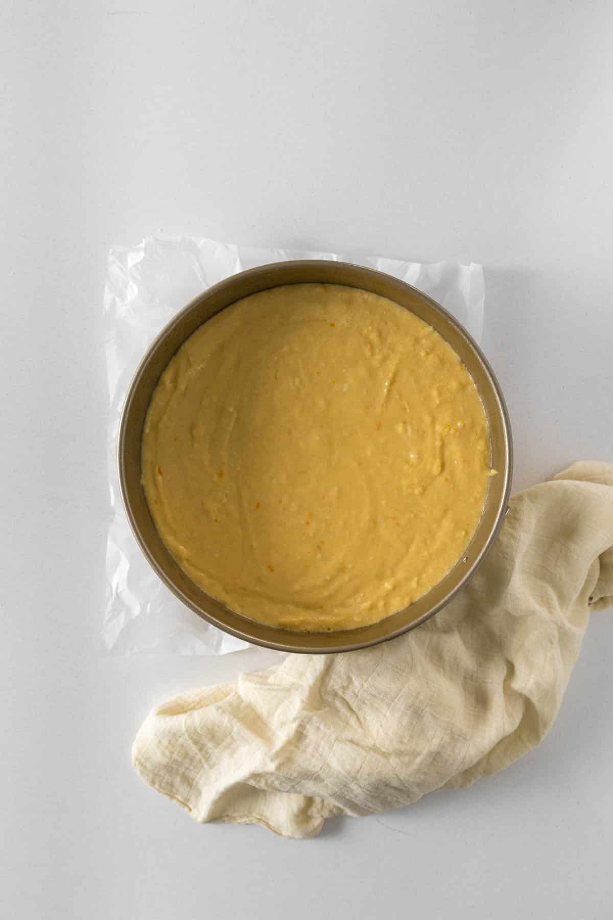 Step 7 - Orange cake poured into prepared cake pan.