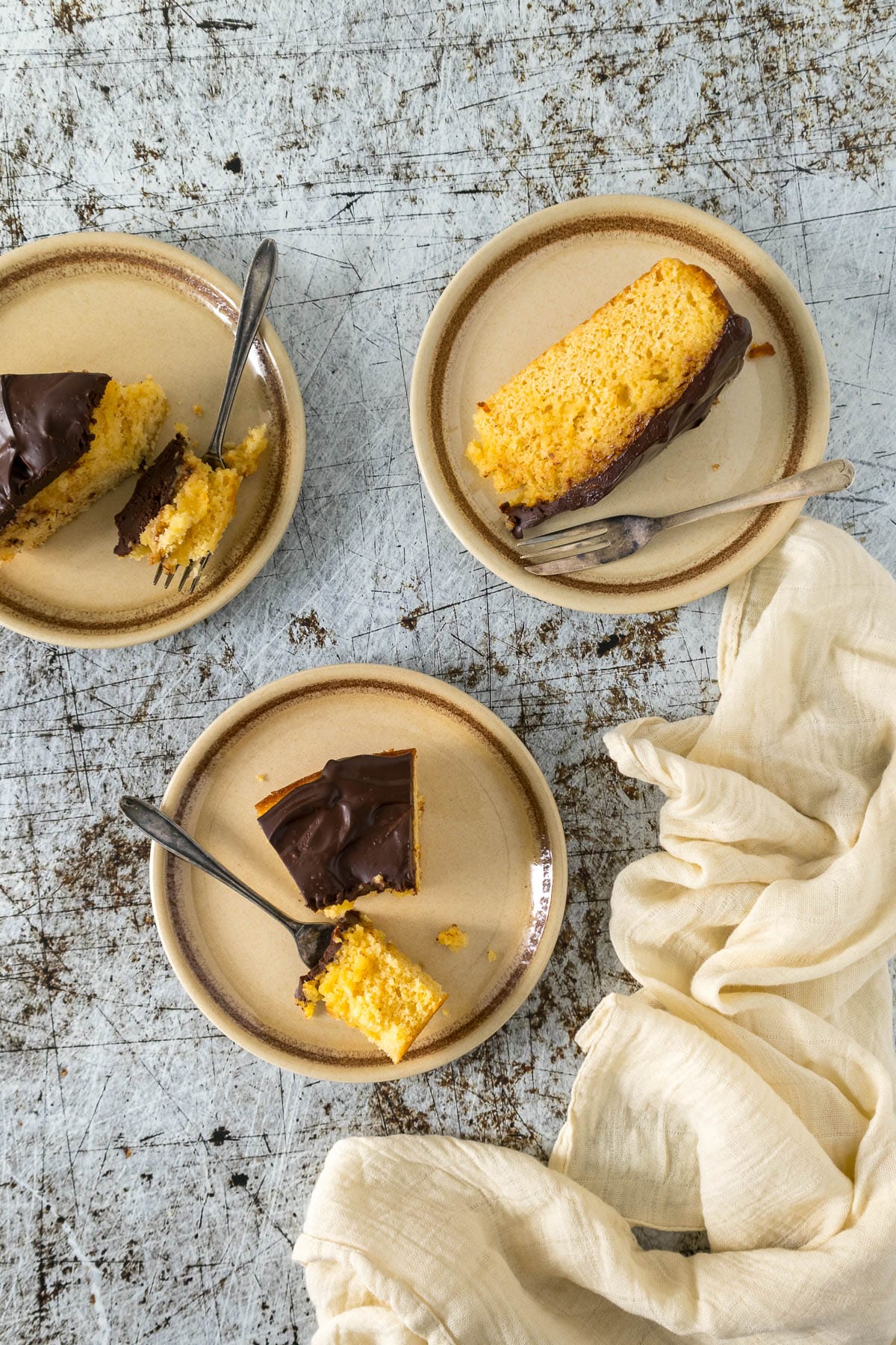 Slices of chocolate orange cake on plates.