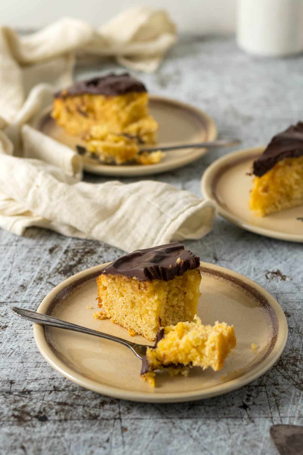 Slices of chocolate orange cake served on plates.