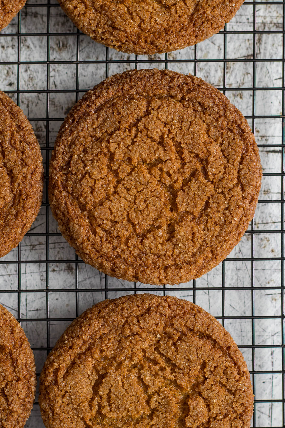 Ginger biscuits cooling on a wire rack.