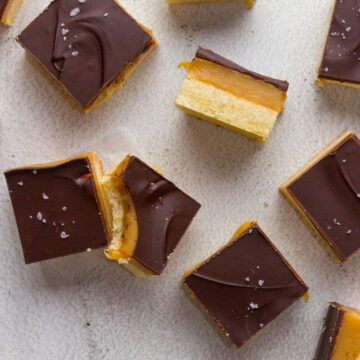 Caramel slices showing shortbread, caramel and chocolate layers.