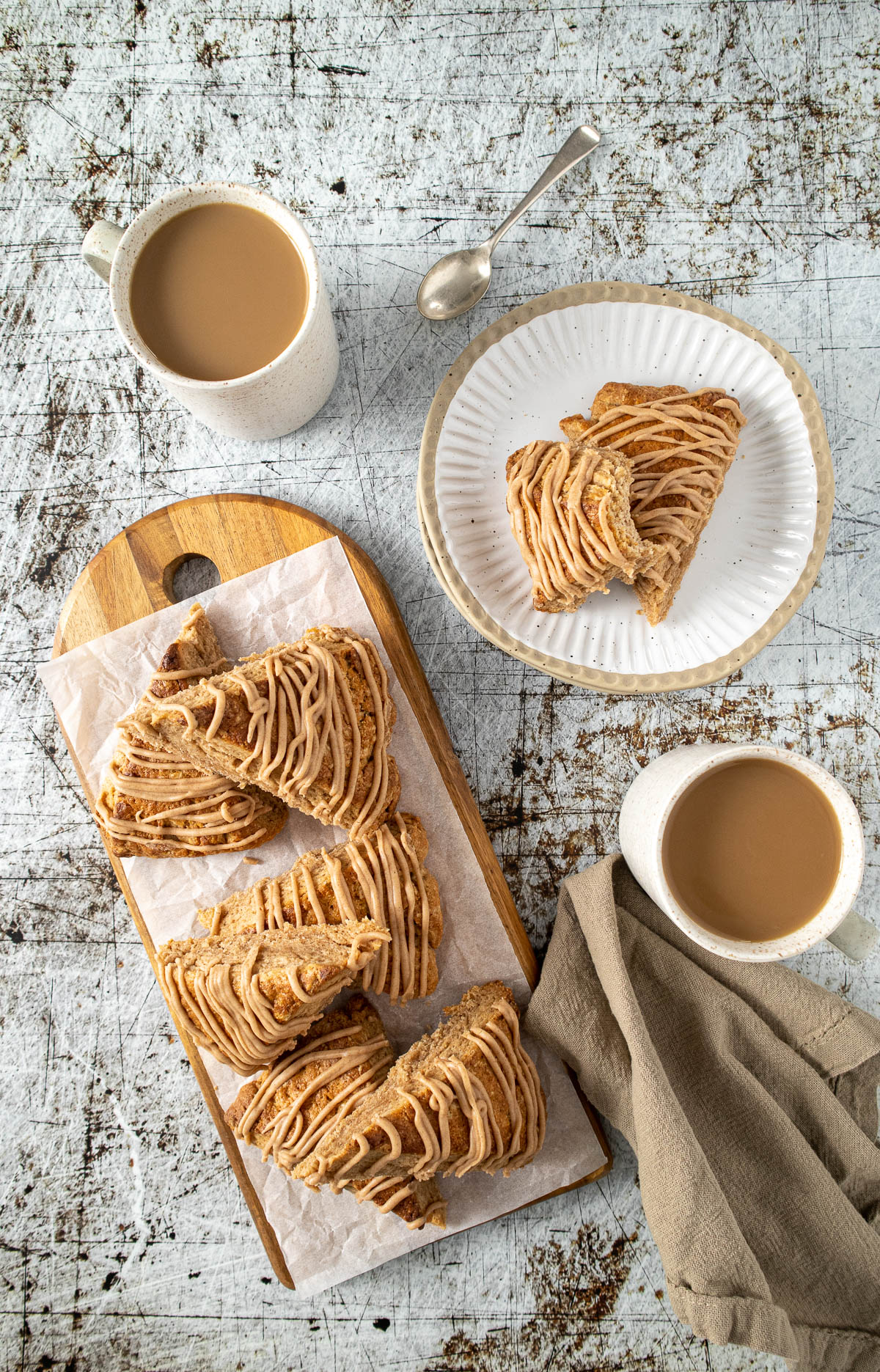 Cinnamon scones on a platter served with coffee.