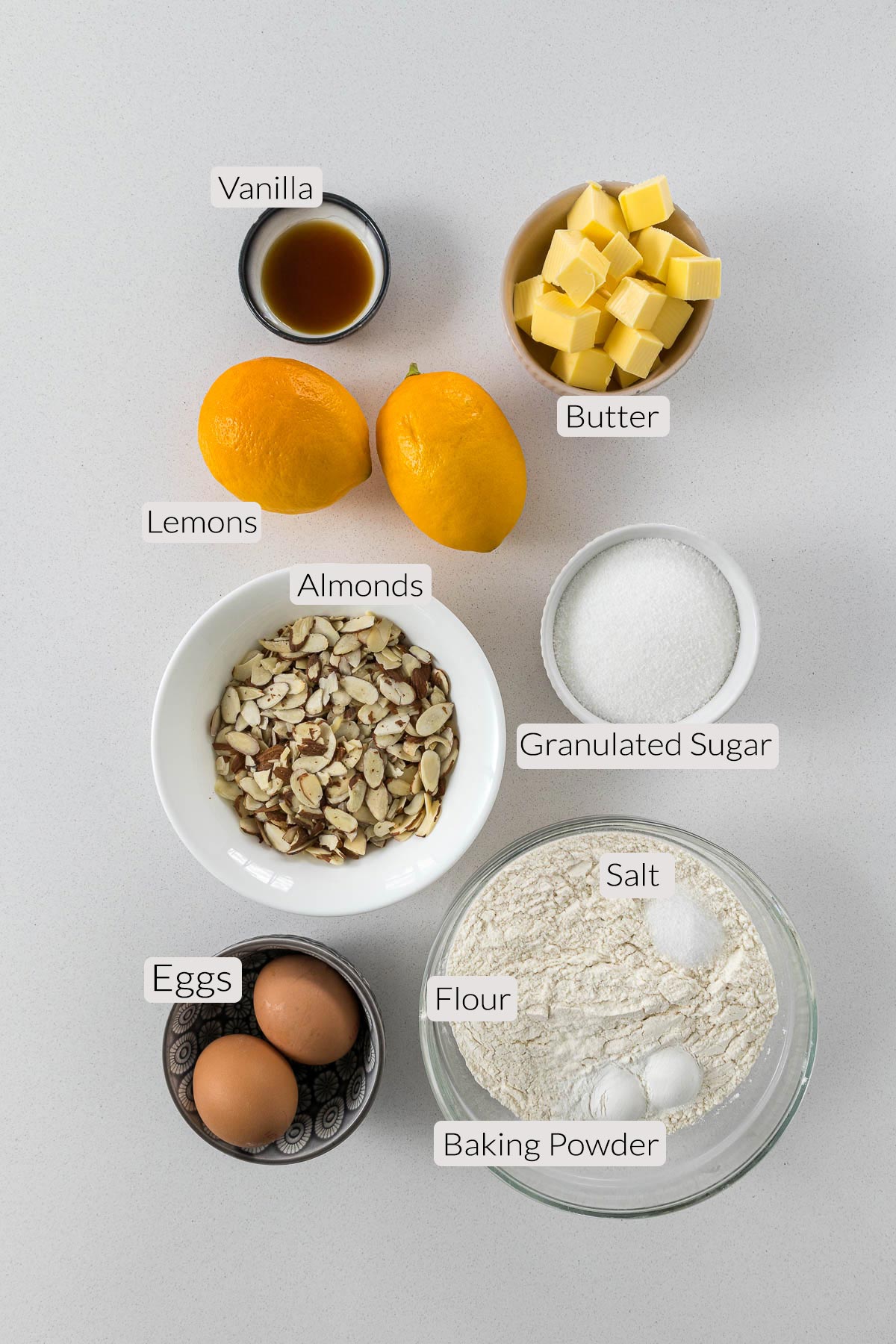 Lemon biscotti - vanilla, butter, lemons, granulated sugar, almonds, eggs, flour, salt, and baking powder.