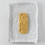 Step 6 - Log of biscotti dough on a baking tray.