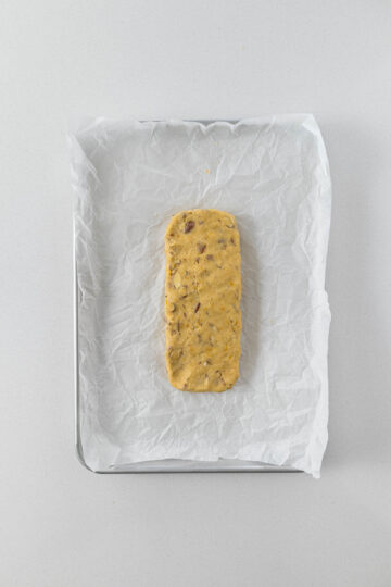 Step 6 - Log of biscotti dough on a baking tray.