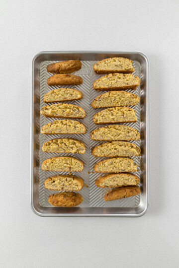 Step 9 - baked biscotti laid out on a baking tray for the second bake.