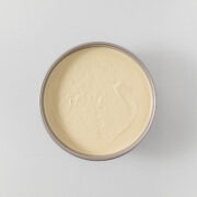 Step 10 - cheesecake filling smoothed over the biscuit/Graham cracker base.