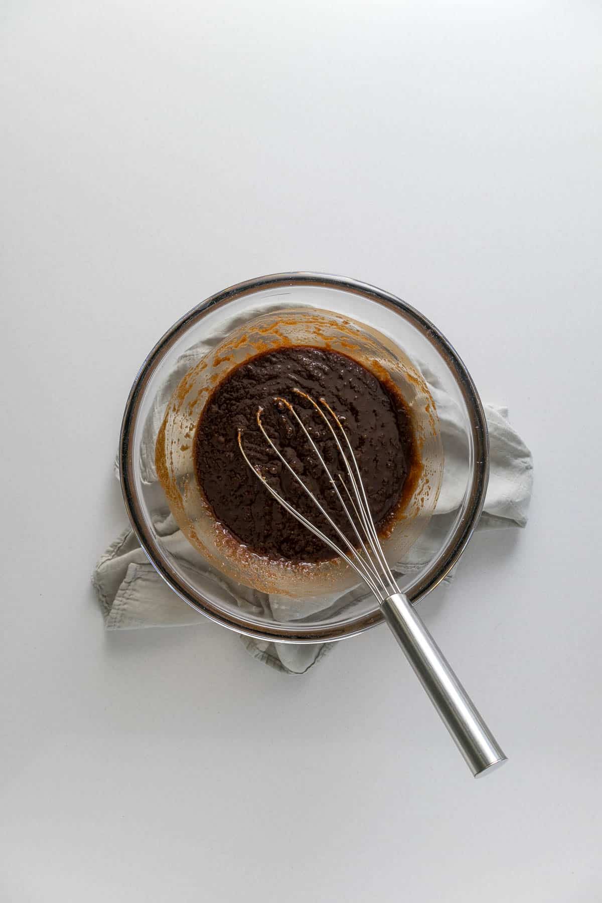 Step 3 - Brown and white sugar whisked into the melted butter and chocolate.