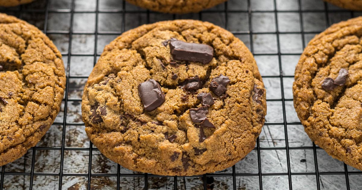 Chocolate chip coffee cookie on a cooling rack.