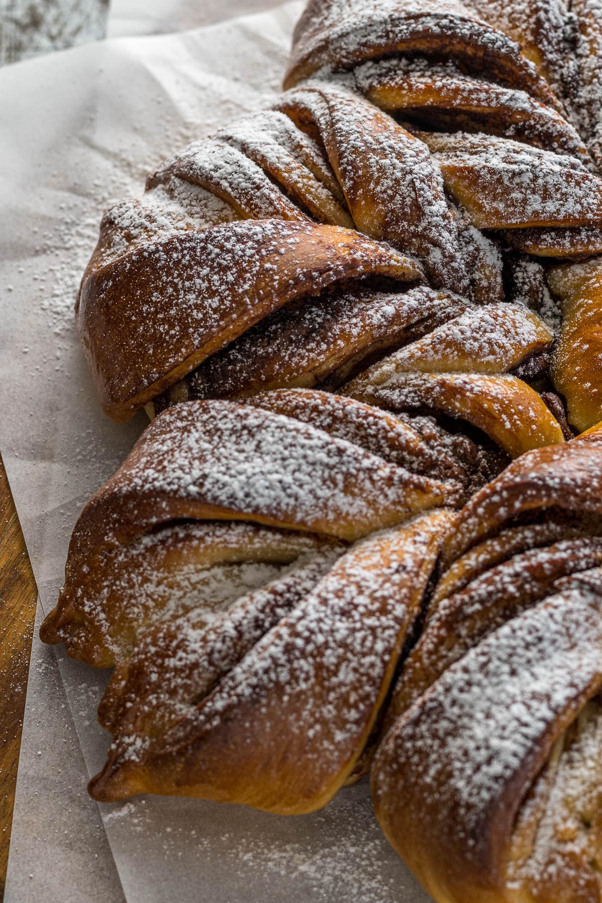 Nutella start bread baked and dusted with powdered sugar.