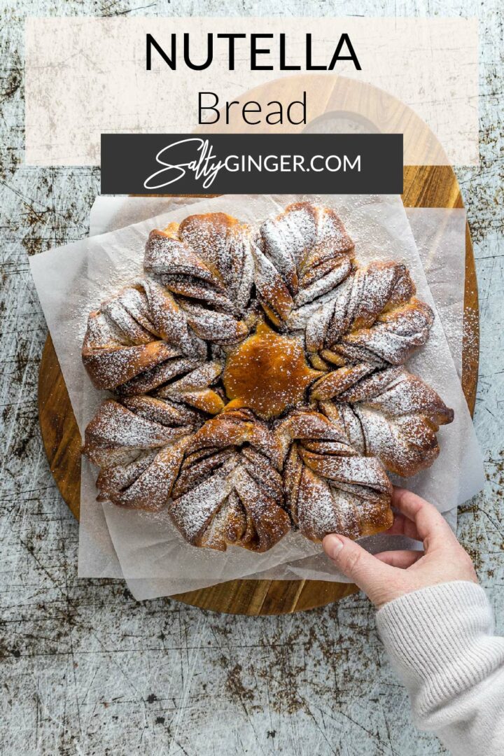 Pin - Nutella star bread on a serving board.