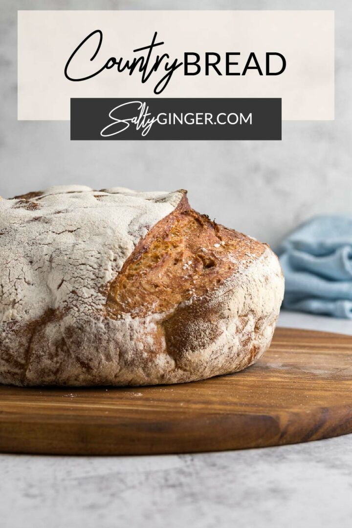 Pin - Loaf of bread on a cutting board.