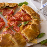 Sliced fresh summer tomato galette.