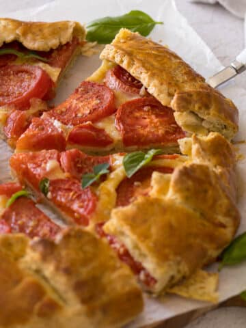 Sliced fresh summer tomato galette.