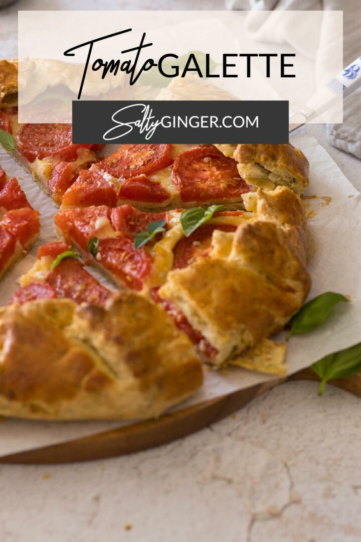 Pin - Tomato Galette, sliced on a serving board.