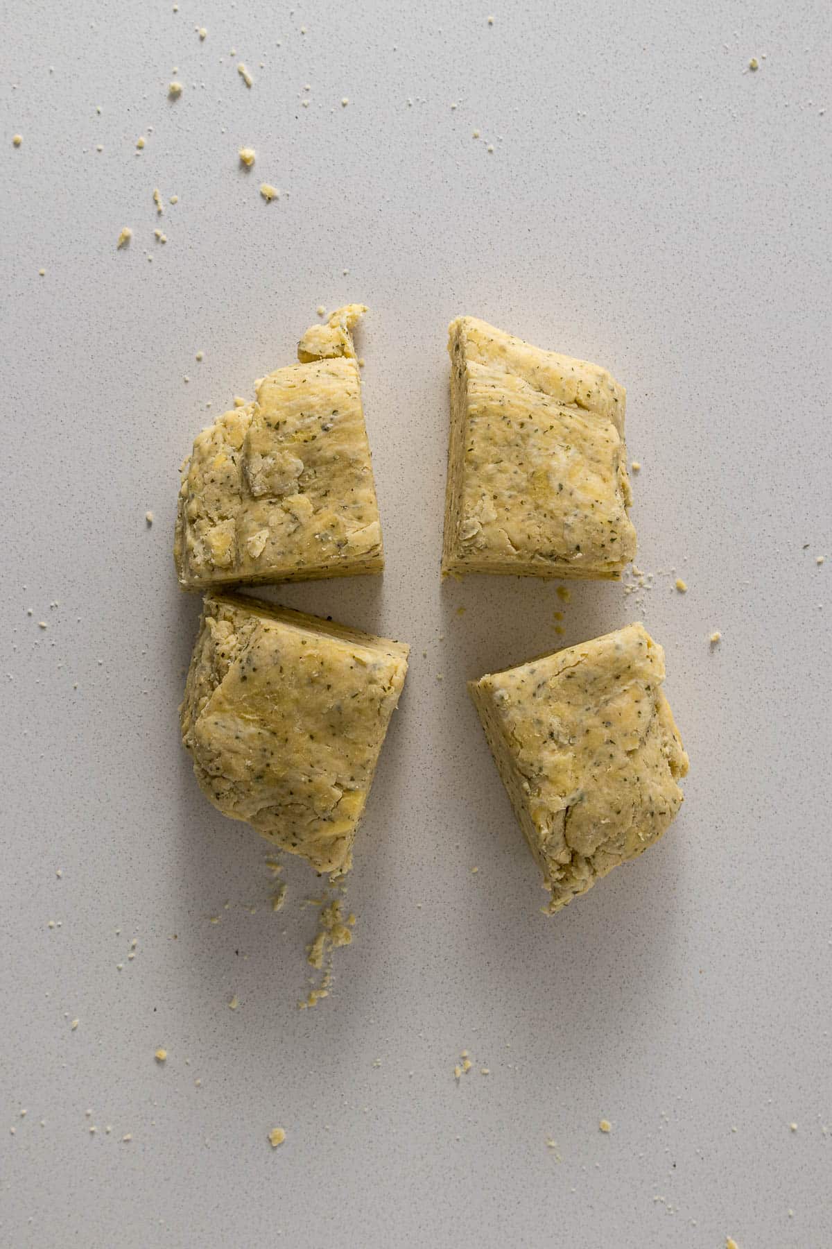 Step 3 - Pastry divided into 4 before being pressed into each other to create a disc.