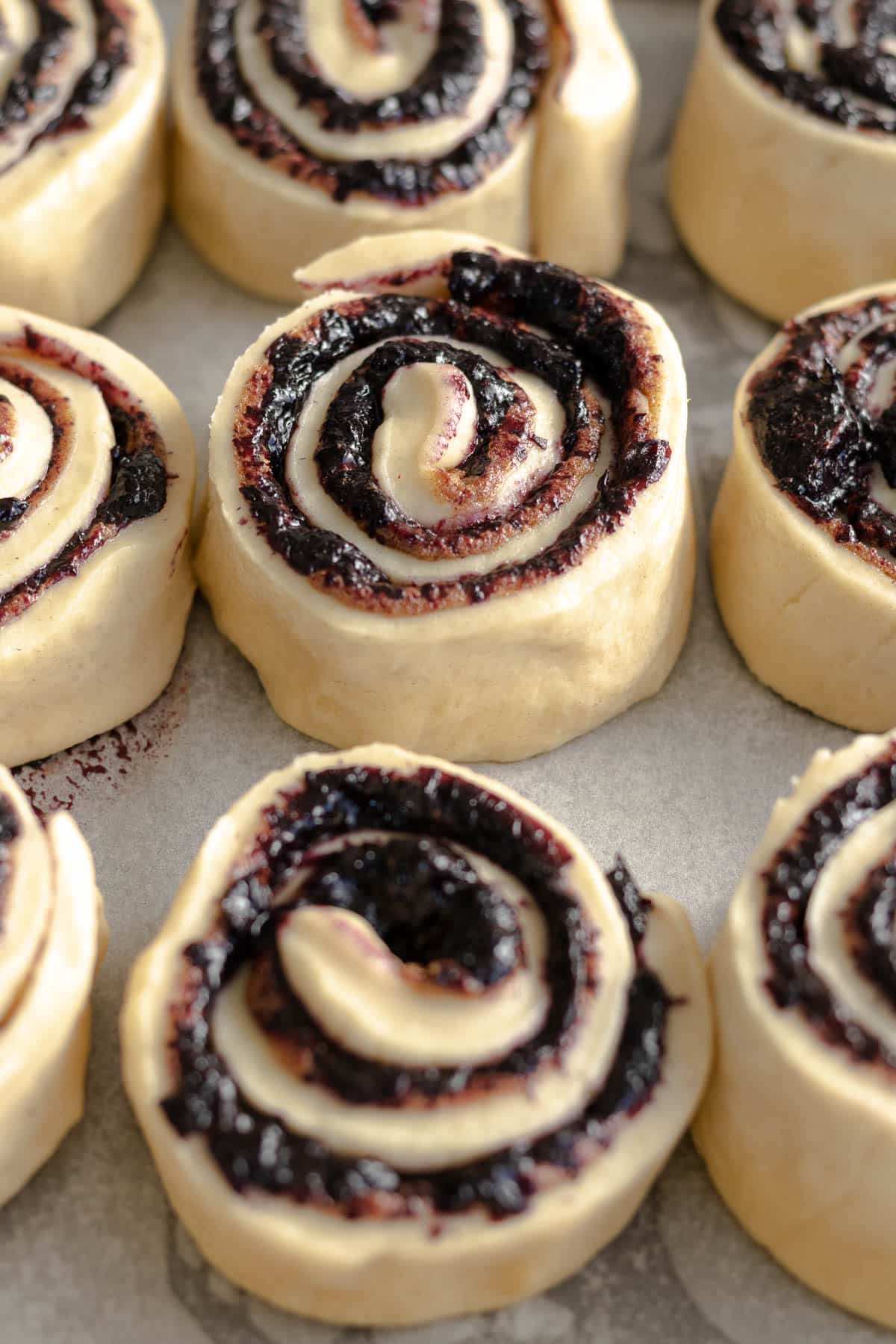 Step 14 - blueberry cinnamon rolls placed into a baking dish for the second rise.