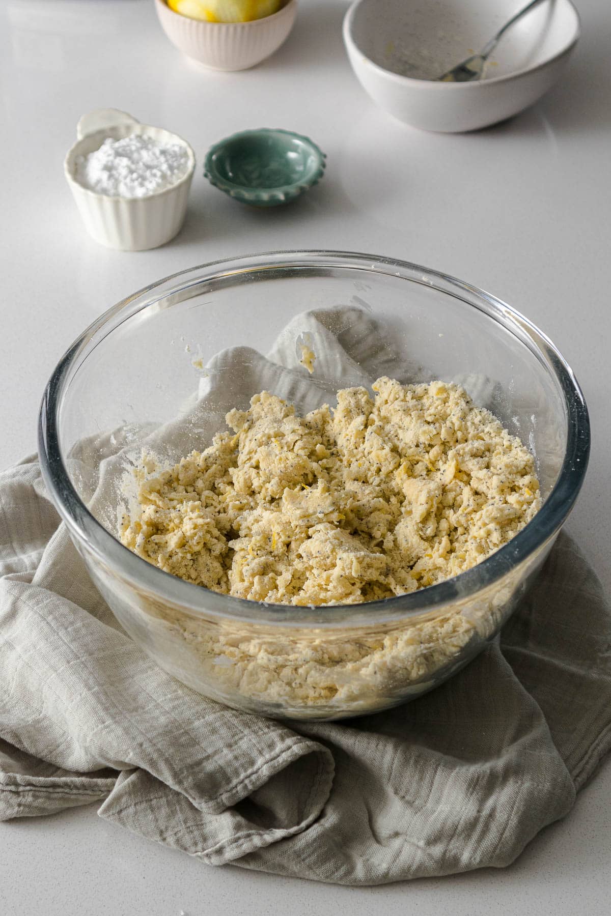 Step 6 - Cream and vanilla stirred through the flour mixture to create a shaggy dough.