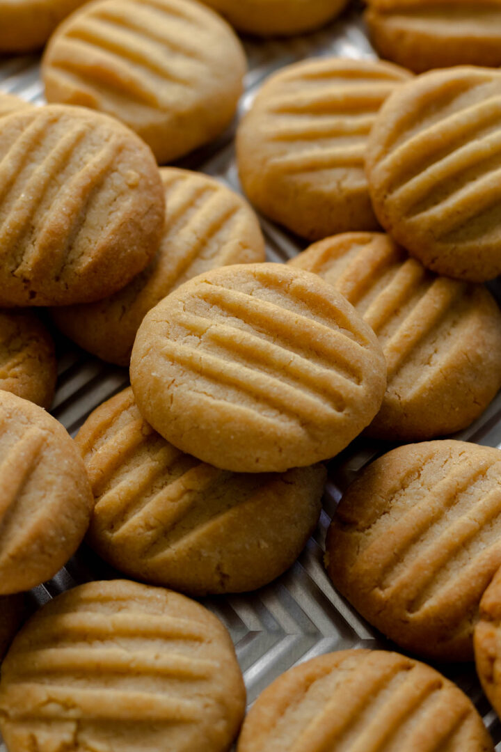 Condensed milk cookies on a baking sheet.