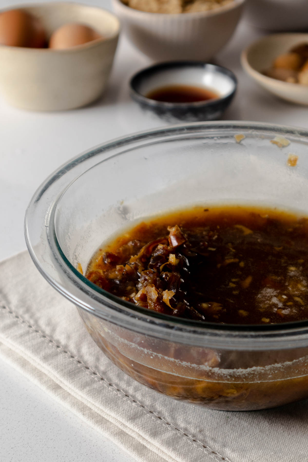 Step 2 - Dates soaking in hot water in a bowl.