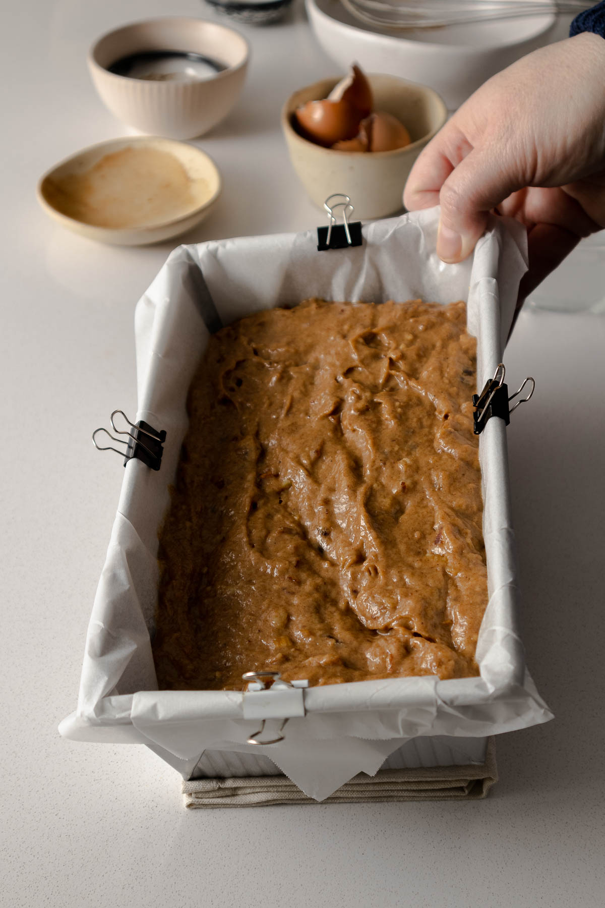 Step 7 - walnut date cake batter smoothed into a loaf pan.