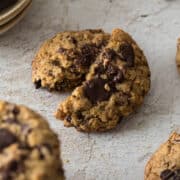 Oatmeal chocolate chip cookie broken in half.