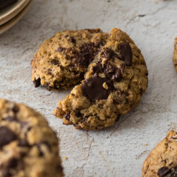 Oatmeal chocolate chip cookie broken in half.